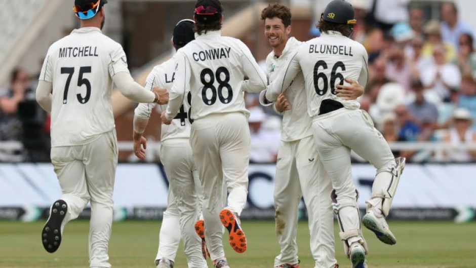 New Zealand's Mitchell Santner (2R) is congratulated after dismissing England's Jamie Smith to seal a 160-run win for the Black Caps in the third Test at Trent Bridge