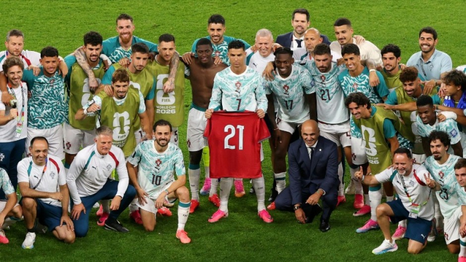 Cristiano Ronaldo and teammates celebrate with a shirt in commemoration of late teammate Diogo Jota after their win over Portugal