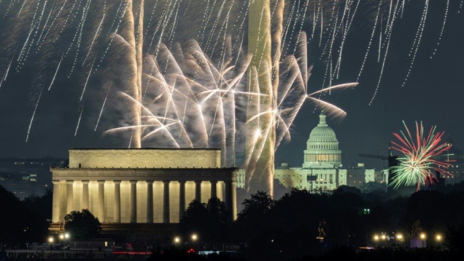 Independence Day fireworks go off over the National Mall in Washington, DC, as seen from the area of the US Marine Corps War Memorial in Arlington, Virginia, on July 4, 2024
