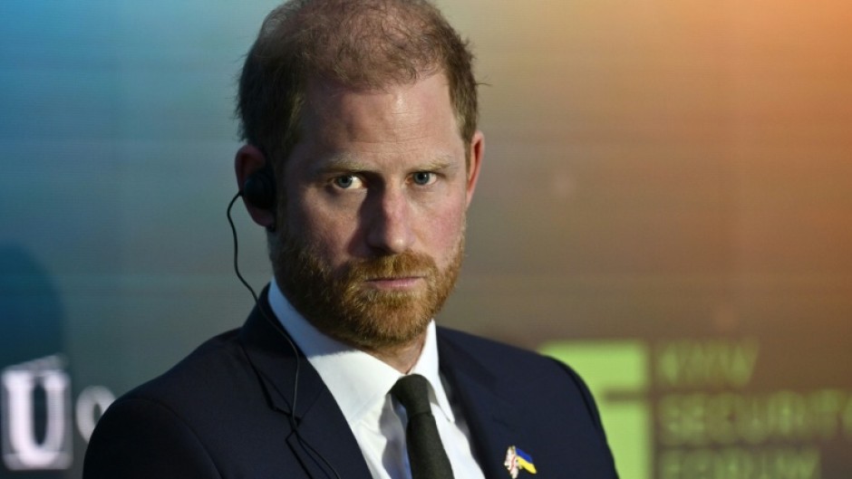 Britain's Prince Harry is due to arrive back in the UK, but without his wife, Meghan, and two children as had originally been planned