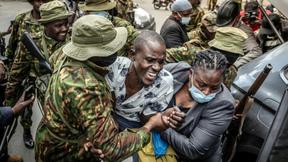 Kenyan police swarmed on a tiny group trying to protest