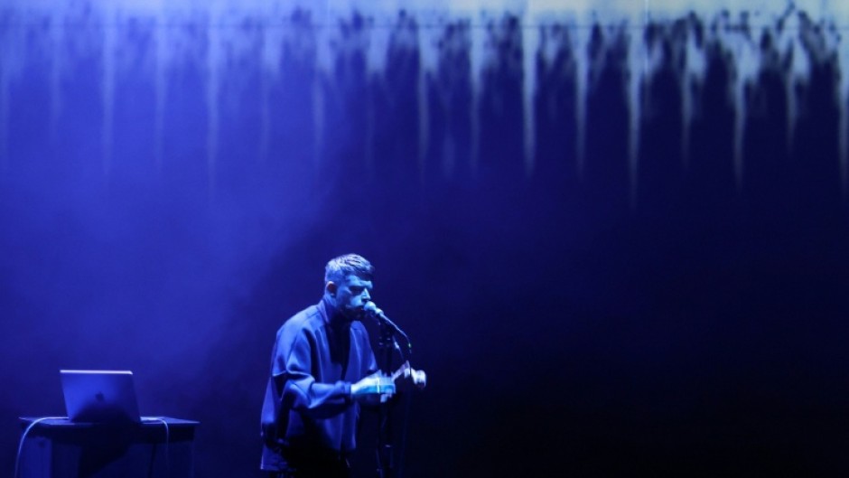 British artist Harry Yeff (also known as Reeps100) rehearses a song which uses artificial intelligence to render the human voice