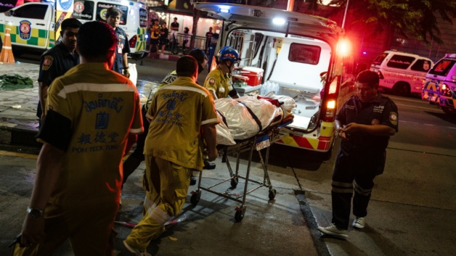 An AFP journalist saw several body bags on the ground outside the Rong Beer Na Lat Phrao bar and restaurant early Monday morning.