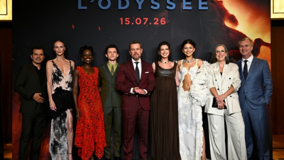 The cast of "The Odyssey" pose with director Christopher Nolan (right) at the Paris premiere