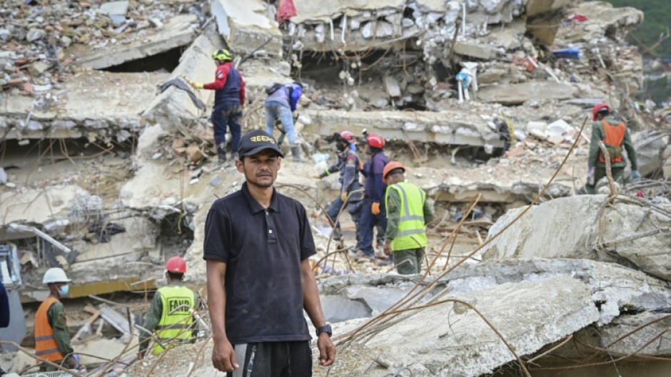 Miguel Baez is looking for the bodies of his family members in the hopes of giving them a dignified burial
