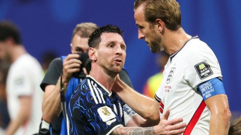 Lionel Messi with England captain Harry Kane