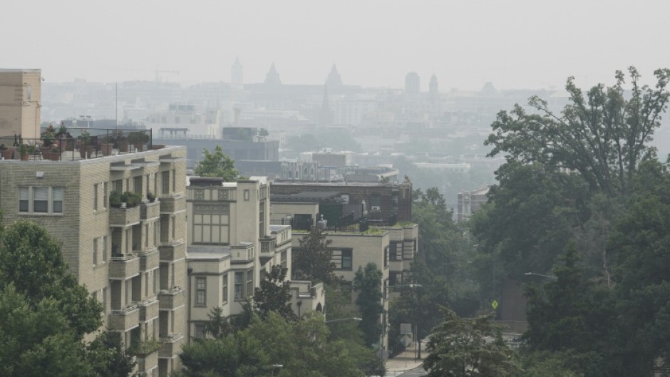 View of downtown Washington, seen from Malcolm X Park, on July 17, 2026 as smoke from Canadian wildfires engulfs the US capital
