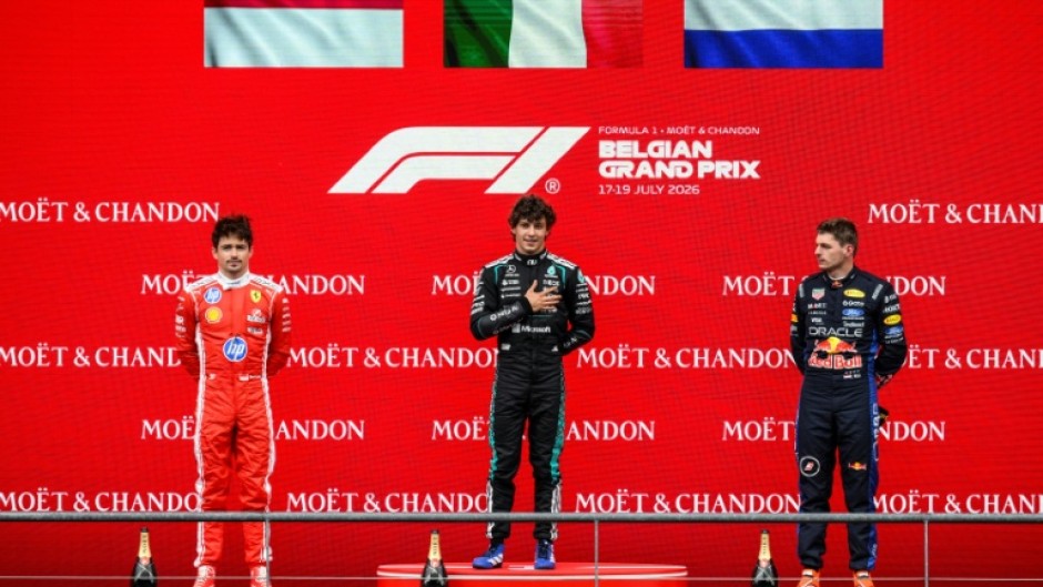 Belgian Grand Pirx winner Kimi Antonelli (C) is flanked by Charles Leclerc (L) who came second and Max Verstappen who was third
