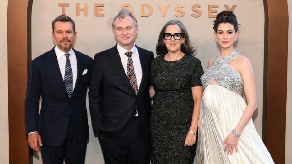 The epic film, directed by Christopher Nolan (middle left) and produced by his wife Emma Thomas (center right), features an ensemble cast including Matt Damon (L) and Anne Hathaway (R)
