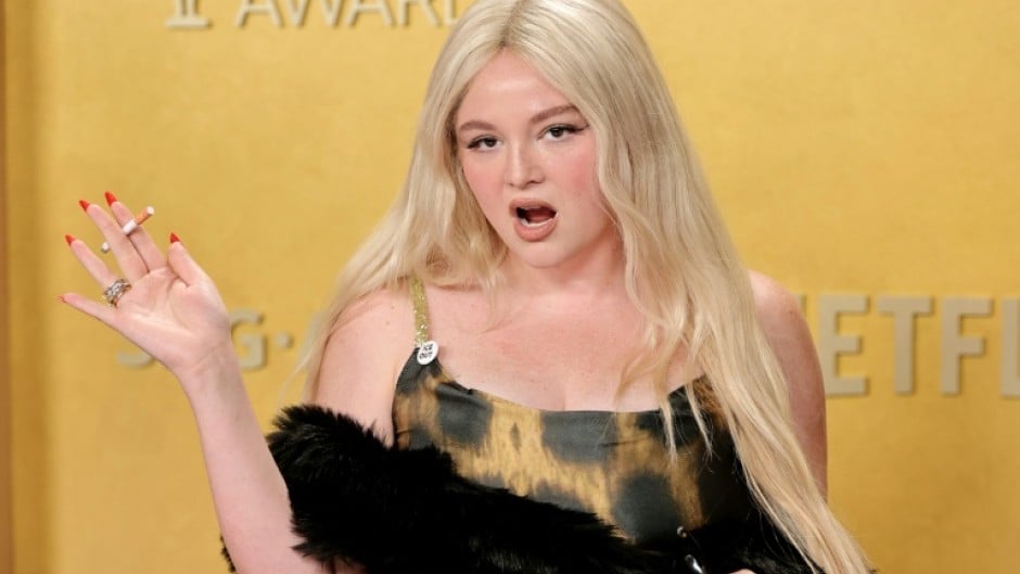 Megan Stalter with a prop cigarette on the red carpet of the 2026 Actor Awards