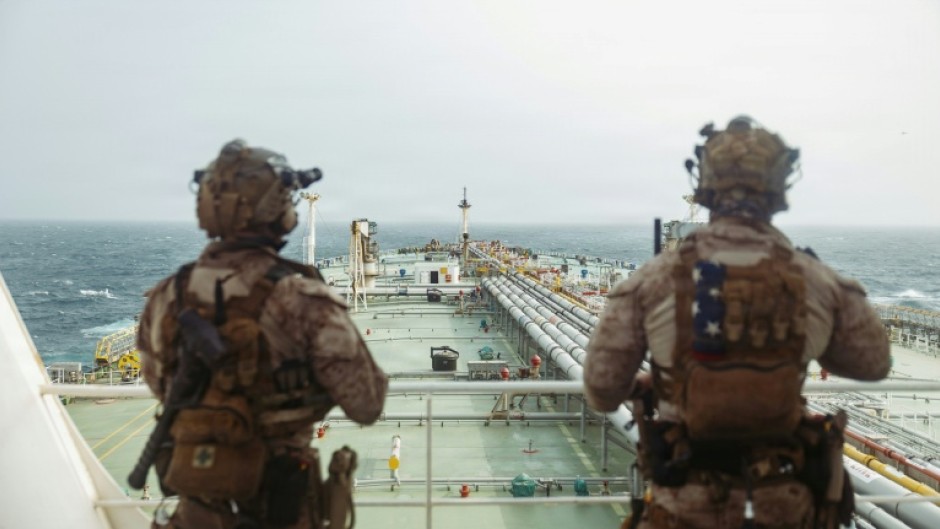 This handout photograph taken on July 16, 2026 by US Central Command Public Affairs shows US Marines from the 11th Marine Expeditionary Unit conducting a verification boarding aboard the M/T Wen Yao in the Gulf of Oman