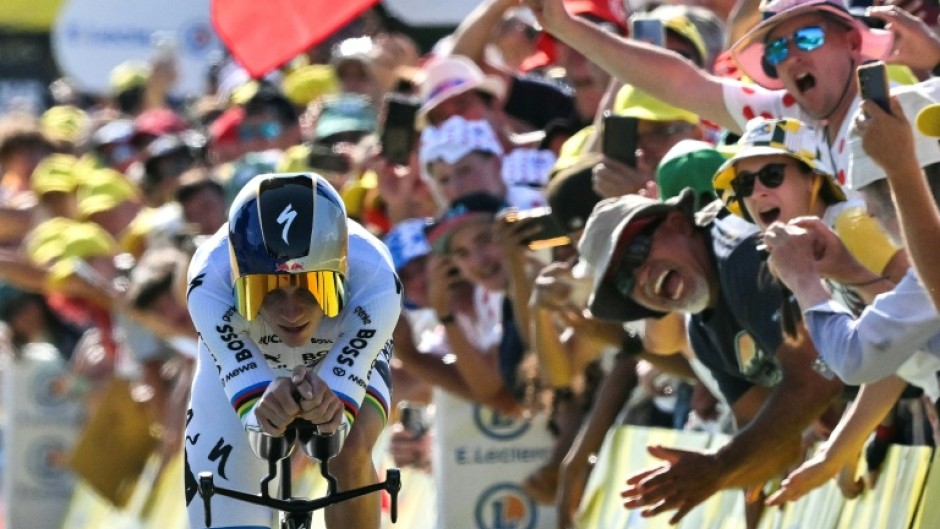 Remco Evenepoel crosses the finish line in a winning time in Thonon-les-Bains