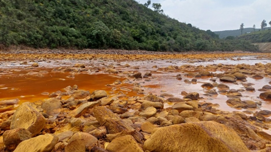This undated handout photo obtained on July 21, 2026, from Luke Bridgestock of the University of St Andrews shows a view of the Tinto River, with pollution from acid mine drainage, in the Iberian Pyrite Belt in southwest Spain