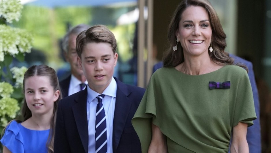 Britain's Prince George of Wales, flanked by Princess Catherine and Princess Charlotte, has become a teenager