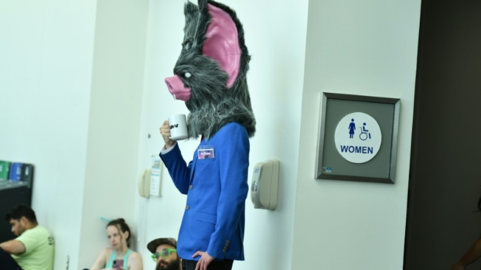 A cosplayer waits by the restrooms during Comic Con International in San Diego