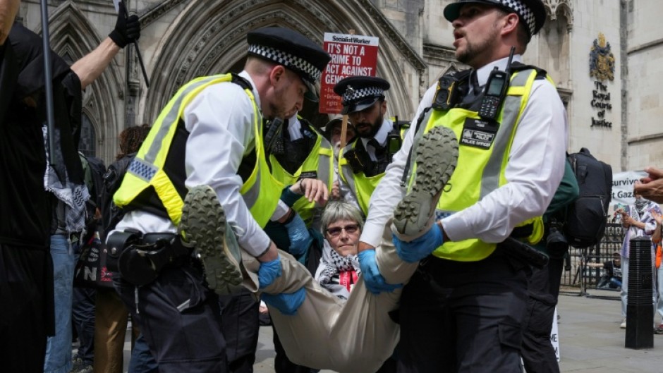 Police remove protesters from outside the Royal Courts Of Justice in central London in June