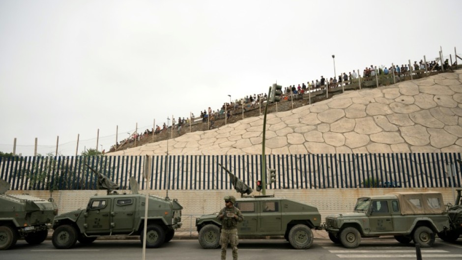 Spain rushed troops, more police, drones, divers and boats to Ceuta