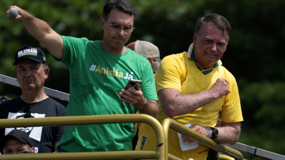 Brazil's former president Jair Bolsonaro (R) and his son Senator Flavio Bolsonaro (L) are allied with US President Donald Trump, who has backed several victorious right-wing candidates in Latin America