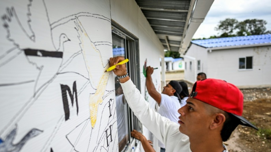 The fate of some 100 ex-guerrillas is uncertain as Colombia's left-wing government is replaced by a bellicose right-wing one