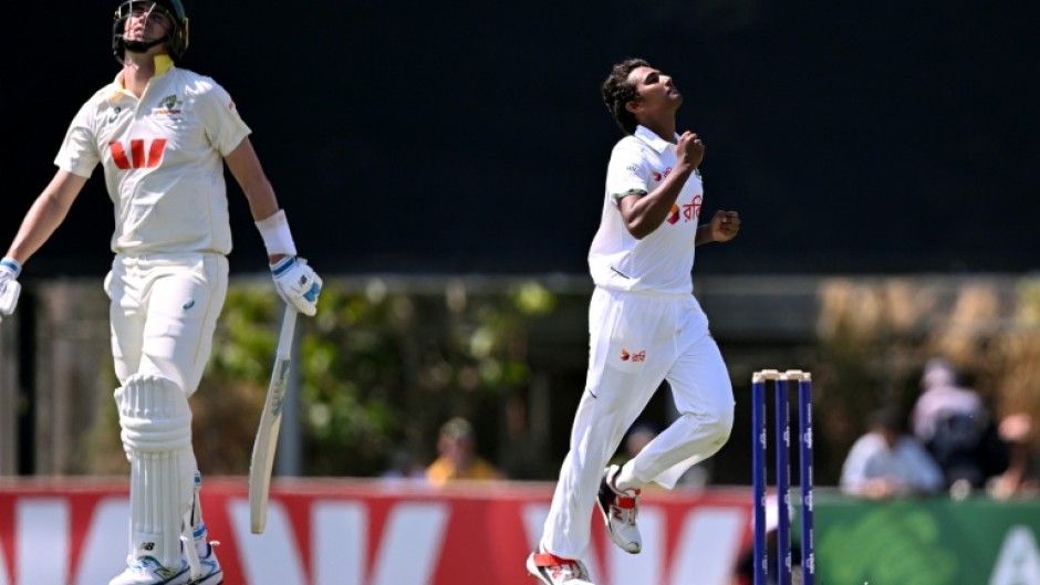Bangladesh bowler Hasan Mahmud celebrates dismissing Pat Cummins