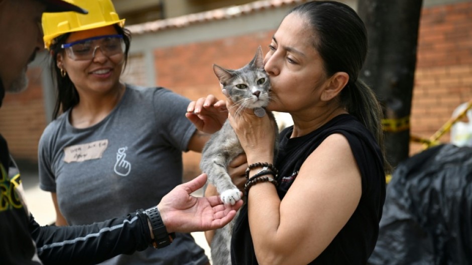 Hundreds of people remain missing in Colombia's quake zone, but some pets have been rescued from the rubble