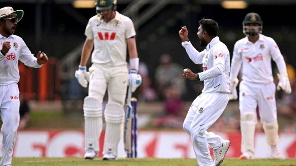 Bangladesh bowler Mehidy Hasan Miraz (2nd R) after dismissing Australia's batsman Pat Cummins in Darwin