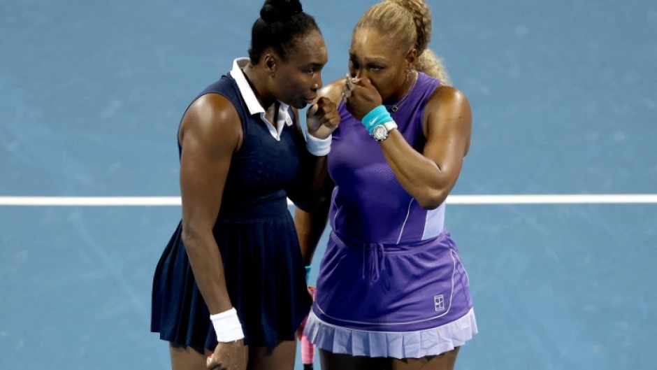 Sisters Venus Williams, left, and Serena Williams, 14-time Grand Slam doubles champions who had not played together competitively in four years, lost in their first match at the WTA and ATP Cincinnati Masters