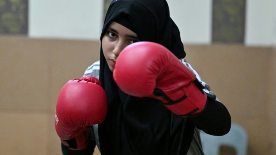 Hoorain Zahra shadow-boxing during a sparring session at a local boxing club in Karachi's Lyari town