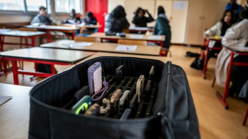 The French government said that a ban on mobile phones in high schools 'could take effect as early as the start of the school year'