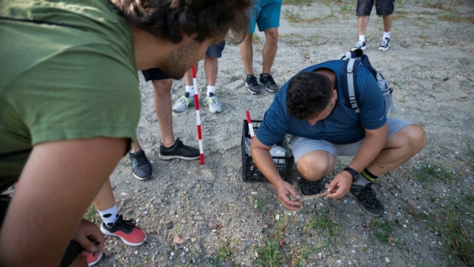 Museum curator Krasimir Kirov (R) says he got many calls after mammoth bones were discovered last month in the area