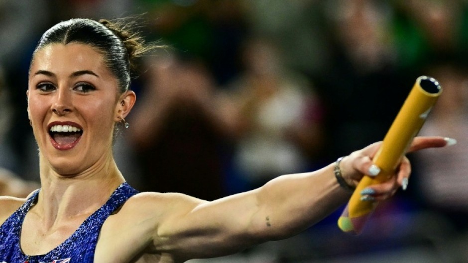 Britain's Amy Hunt celebrates as she crosses the finish line in the European 4x100m mixed relay