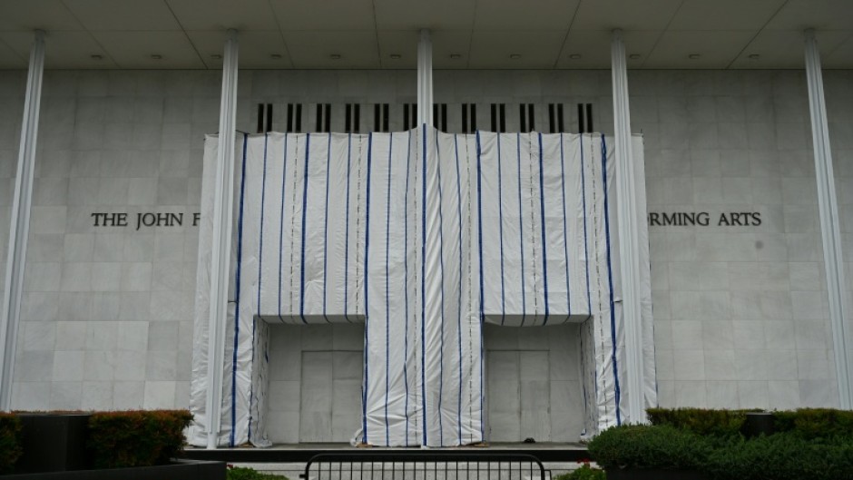 A tarpaulin covers the facade of the Kennedy Center where President Donald Trump's name was removed