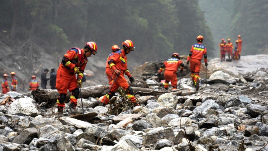Fire and rescue personnel conduct search and rescue operations 2 kilometers from Gyirong Port days after the August 26 mudslide