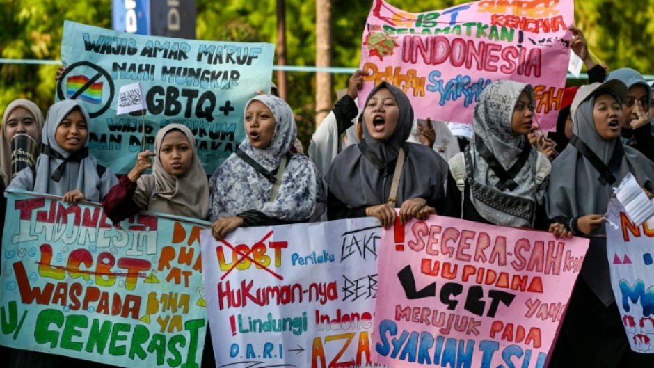 Protesters take part in an anti-LGBTQ rally organised by pro-Islamic organisations in Surabaya on August 9, 2026