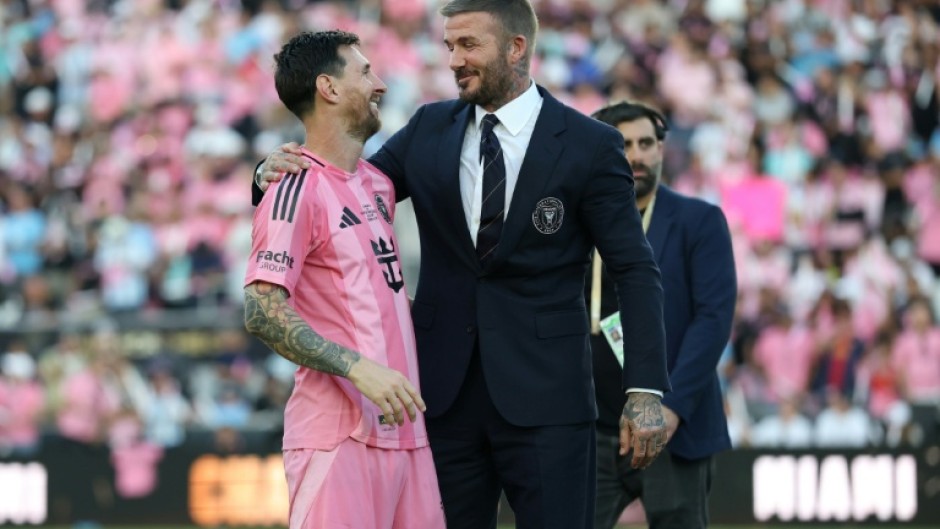 Lionel Messi (L) and David Beckham