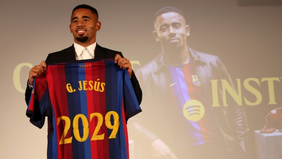 Brazilian forward Gabriel Jesus poses with his jersey during his official presentation at Barcelona