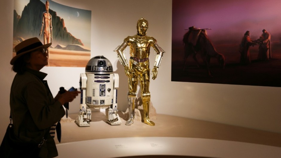A visitor views exhibits from the Star Wars gallery during the Lucas Museum of Narrative Art press preview in Los Angeles