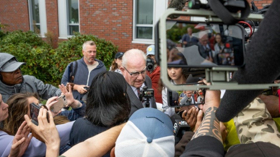 Kevin Reddington, defense attorney for Lindsay Clancy, is surrounded by press as he arrives at the courthouse during Clancy's murder trial in Plymouth, Massachusetts over the strangulation of her three young children