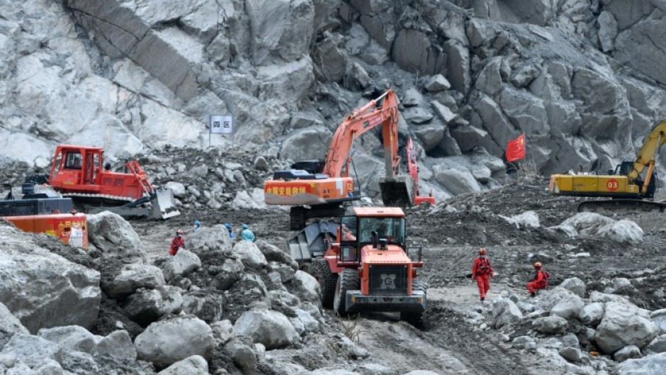 Excavators work during recovery efforts at the site of the destroyed Gyirong Port border crossing in China’s western Tibet region