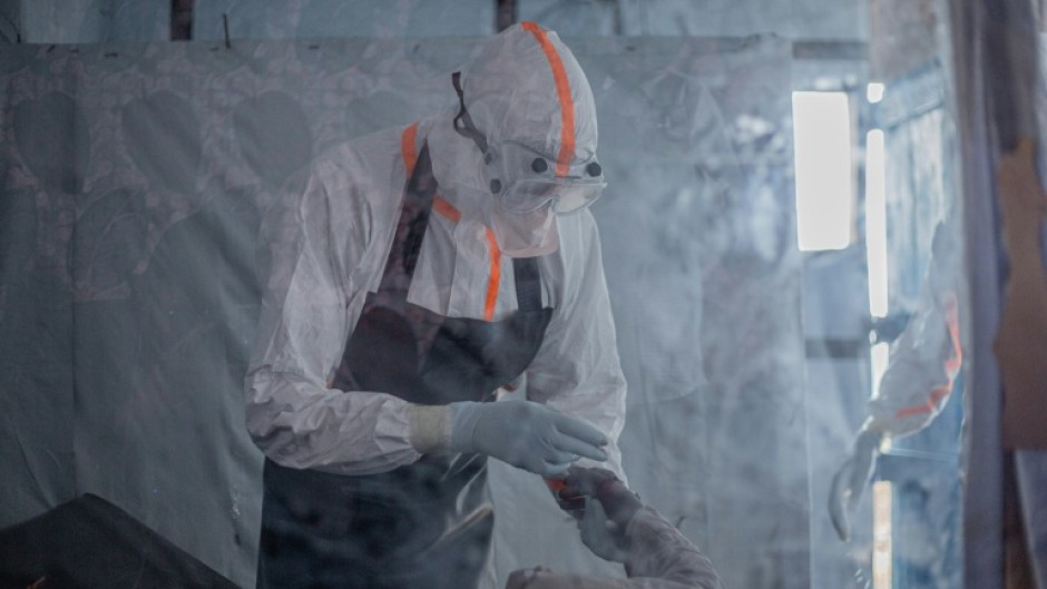 Three medical staff are needed for each Ebola patient