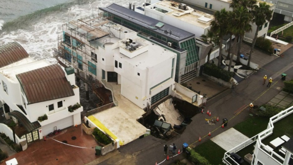 Pounding surf has created a sinkhole on one side of a multi-million dollar house in swanky Malibu that reports said belongs to Nicholas Cage