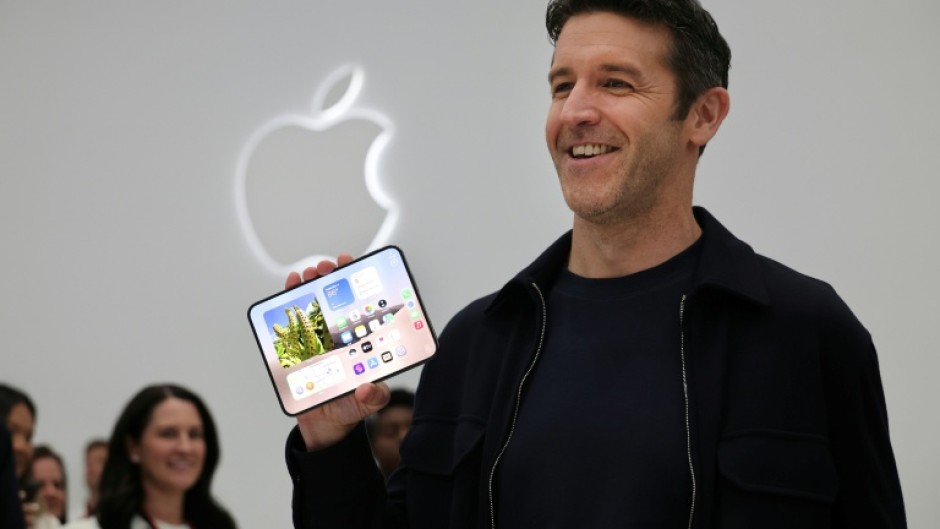 Apple CEO John Ternus holds the iPhone Duo