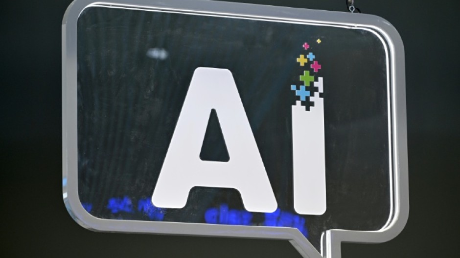 An srtificial intelligence logo is pictured at the Mobile World Congress (MWC), the telecom industry's biggest annual gathering, in Barcelona on February 27, 2024