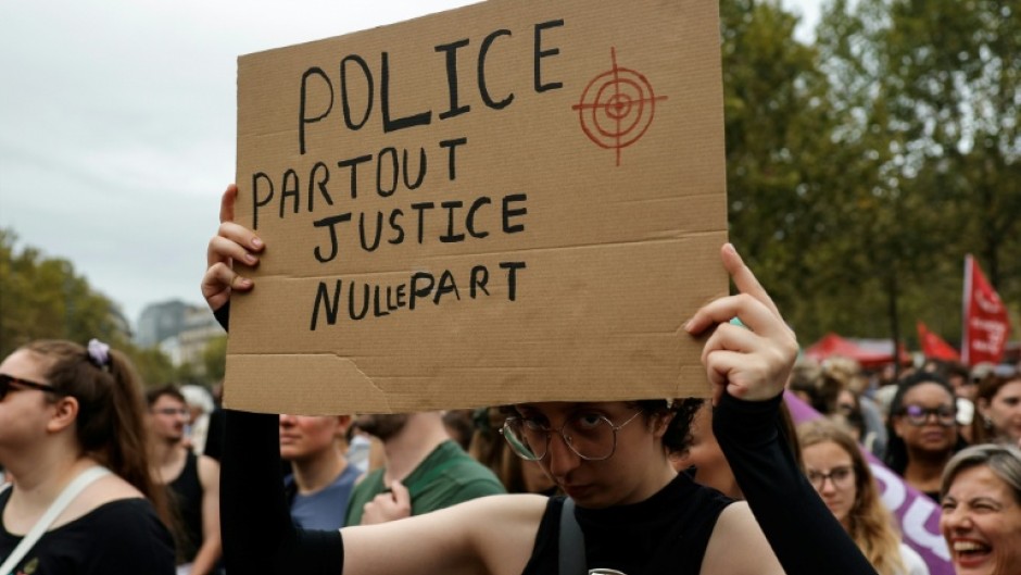 'Police everywhere, justice nowhere': many of the placards reflected mistrust of the police