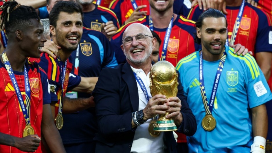 Luis de la Fuente holds the World Cup trophy after Spain beat Argentina in the final in New Jersey