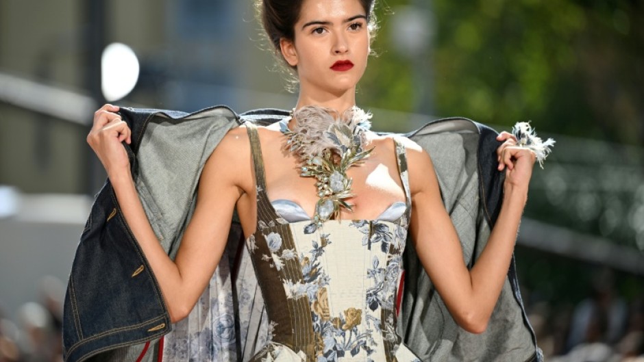 Sardinian designer Antonio Marras presented wide grey suits embroidered with flowers nostalgic silk or tulle dresses and deconstructed parkas