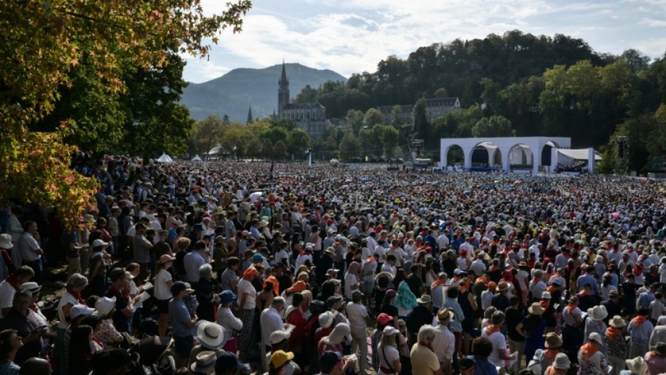 Worshippers packed a field in Lourdes