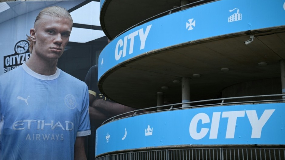 A poster of Manchester City striker Erling Haaland is pictured outside The Etihad Stadium