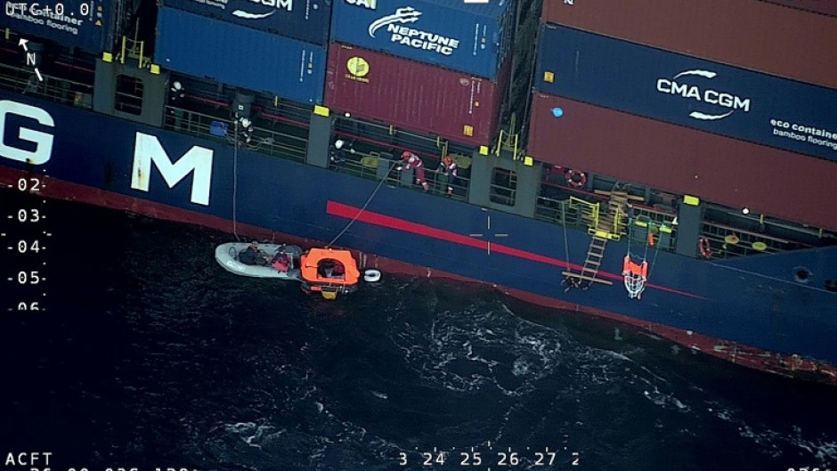 A 143-metre (470-foot) container ship rescued four sailors after their yacht collided with a sperm whale