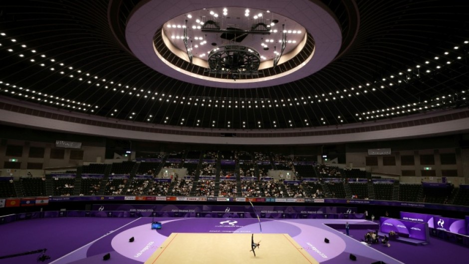 Uzbekistan’s Lola Djuraeva competes in the individual ribbon of the rhythmic gymnastics qualification round during the 2026 Asian Games at the Nagoya General Gymnasium in Nagoya on October 1, 2026.